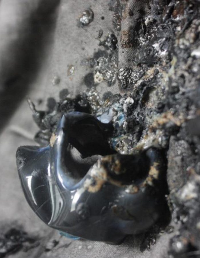 The Noisy Wall I (2017). (Detail). Assorted clays, plastics, cassava starch, manganese dioxide, gum-Arabic on fabric. Dimension varies